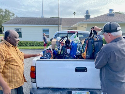 Neighbors serving Thanksgiving Meals at Estero Church Neighbors helping neighbors in Estero, Fla. Join Estero Church this Thanksgiving and help feed families in need.